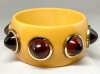 BB338 goldenrod bakelite bangle with rootbeer cone dots